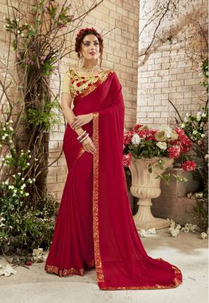 Adorn The Pretty Angelic Look Wearing This Designer Saree In Red Color Paired With Beige Colored Blouse. This Saree Is Fabricated On Chiffon Paired With Art Silk Blouse. it is Light Weight And Easy To Carry All Day Long.