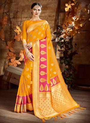 Celebrate This Festive Season Wearing This Silk Saree In Yellow Color Paired With Yellow Colored Blouse. This Saree And Blouse Are Fabricated On Cora art Silk Beautified With Weave All Over. 