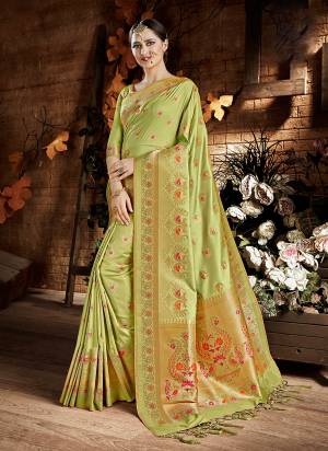 Look Pretty In This Soft Color Pallete Wearing This Silk Saree In Light Green Color Paired With Light Green Colored Blouse. This Saree And Blouse Are Fabricated On Cora Art Silk. Its Fabric Ensures Superb Comfort all Day Long.