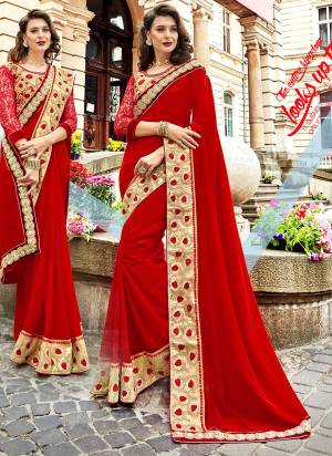 Adorn The Pretty Angelic Look Wearing This Designer Saree In Red Color Paired With Beige Colored Blouse. This Saree Is Based On Georgette Fabric Paired With Art Silk And Net Fabricated Blouse. It Is Beautified With Embroidery Over The Blouse And Saree Lace Border.