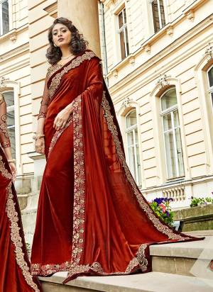 New And Unique Shade Is Here To Definitely Add Into Your Wardrobe With This Designer Saree In Rust Maroon Color Paired With Rust Maroon Colored Blouse. This Saree Is Fabricated On Silk Georgette Paired With Art Silk And Net Fabricated Blouse. Buy This Designer Saree Now.