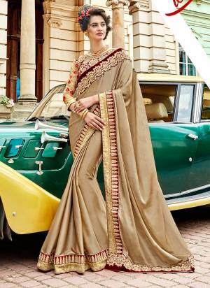 Simple And Elegant Looking Designer Saree Is Here In Beige Color Paired With Maroon Colored Blouse, This Saree Is Fabricated On Silk Georegtte Paired With Art Silk And Net Fabricated Blouse. It Has Embroidered Saree Lace Border And Embroidered Blouse.
