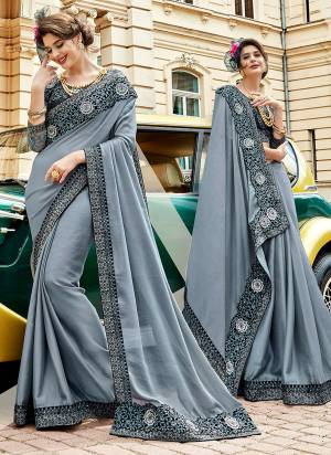 Flaunt Your Rich And Elegant Look Weairng this Designer Saree In Grey Color Paired With Black Colored Blouse. This Pretty Elegant Saree Is Fabricated On Silk Georgette Paired With Art Silk And Net Fabricated Blouse. Buy This Saree Now.