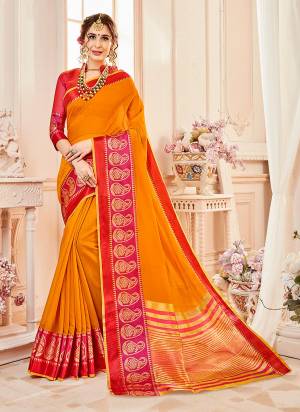 Celebrate This Festive Wearing Some Attractive Shades With This Saree In Musturd Yellow Color Paired With Contrasting Dark Pink Colored Blouse. This Saree And Blouse are Fabricated On Cotton Silk Beautified With Weave. 