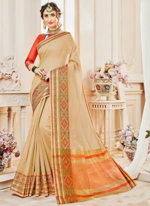 Simple And Elegant Looking Saree Is Here In Beige Color Paired With Orange Colored Blouse. This Rich and Elegant Looking Saree Is Based On Cotton Silk Beautified With Weave. This Saree Is light Weight And Easy To Carry All Day Long.