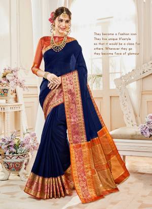 Enhance Your Personality Wearing This Saree In Dark Blue Color Paired With Contrasting Rust Orange Colored Blouse. This Saree And Blouse Are Fabricated On Cotton Silk Beautified With Weave All Over. Buy This Saree Now.