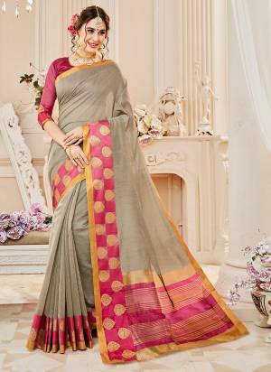 Flaunt Your Rich And Elegant Taste Wearing This Pretty Saree In Grey Color Paired With Dark Pink Colored Blouse. This Saree And Blouse Are Fabricated On Cotton Silk Beautified with Quite Simple Weave Over The Border.
