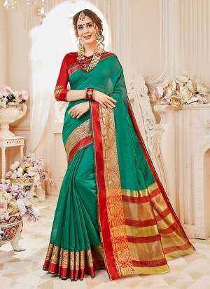 Look Pretty Wearing This Saree In Teal Green Color Paired With Red Colored Blouse. This Saree And Blouse Are Fabricated On Cotton Silk Beautified With Weave. It Is Light In Weight And Also Easy To Carry All Day Long.