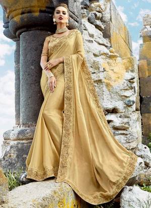Simple And Elegant Looking Designer Saree Is Here In Beige Color Paired With Beige Colored Blouse. This Saree Is Fabricated On Chiffon Paired With Art Silk fabricated Blouse. It Is Beautufied With Embroidery Over The Blouse And Saree Lace Border.