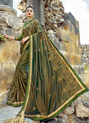 Here Is A Beautiful Two Tone Saree In Green Color Paired With Green Colored Blouse. This Saree Is Fabricated On Silk Paired With Art Silk Fabricated Blouse. This Designer Saree IS Beautified With Attractive Embroidery. 