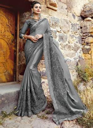 Flaunt Your Rich And Elegant Look, Wearing This Beautiful Designer Saree In Grey Color Paired With Grey Colored Blouse. This Saree Is Fabricated On Chiffon Paired With Art Silk Fabricated Blouse. This Saree Is Light Weight And Easy To Drape Which Is Easy To Carry All Day Long.