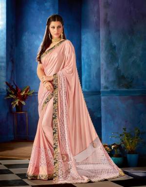 This festive season let your saree decide your sartorial mood. Perk it up in this pretty pastel pink saree and look like a fashion prowess. 