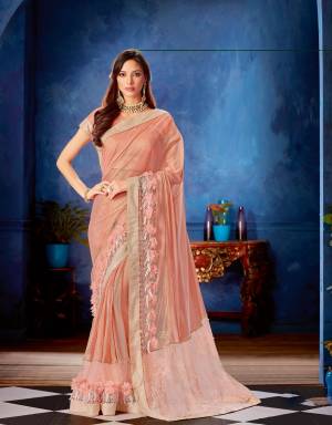 Strike a perfect balance between modern day trends and the traditional attire in this designer pink saree and look wonderful. 