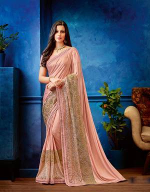 Feel like a neo-classical princess with a touch of Indian to it in this pretty baby pink saree with just the right amount of glittering gold to it . 
