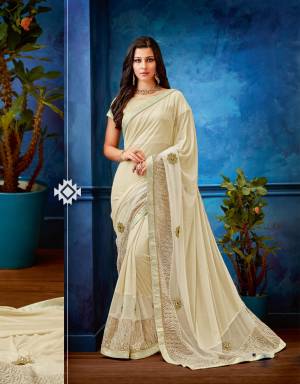 Drape yourself in radiance and exude goddess like aura in this off-white saree . Pair with kundan jewels to look mesmerizing. 