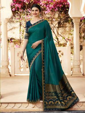 You Will Definitely Earn Lots Of Compliments Wearing This Designer Saree In Teal Blue Color Paired With Navy Blue Colored Blouse. This Saree Is Fabricated On Georgette And Jacquard Paired With Art Silk And Jacquard Fabricated Blouse. Buy This Designer Saree Now.
