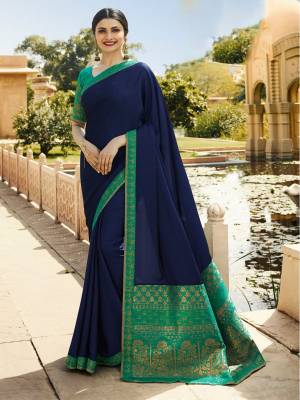 Enhance Your Personality Wearing this Designer Navy Blue Colored Saree Paired With Contrasting Sea Green Colored Blouse. This Saree Is Fabricated On Georgette And Jacquard Paired With Art Silk And Jacquard Fabricated Blouse. Its Attractive Part Is Its Blouse And Saree pallu. Buy Now,