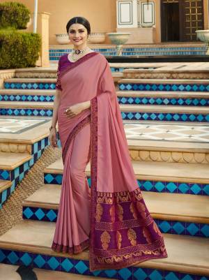 Look Pretty Wearing This Designer Saree In Light Pink Color Paired With Purple Colored Blouse. This Saree Is Fabricated On Georgette And Jacquard Paired With Art Silk And Jacquard Fabricated Blouse. This Pretty Elegant Looking Saree Is Suitable For All Occasion Wear.