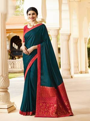 Add This Lovely Designer Saree To Your Wardrobe In Dark Teal Blue Color Paired With Contrasting Dark Pink Colored Blouse. This Saree IS Fabricated Georgette Based Paired With Art Silk Fabricated Blouse. Buy This Saree Now.