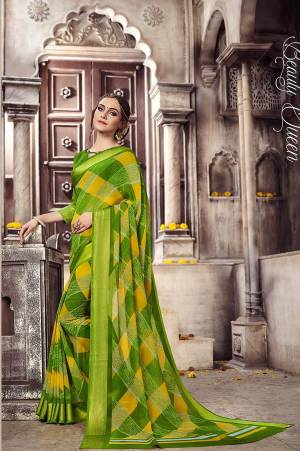 Grab This Pretty Saree In Green Color Paired With Green Colored Blouse. This Saree And Blouse are Fabricated On Georgette Beautified With Simple Prints. It Is Light Weight And Easy To Carry All Day Long.