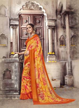 For A Summer Appeal, Grab This Saree In Yellow And Orange Color Paired With Orange Colored Blouse. This Saree And Blouse Are Fabricated On Georgette Beautified With Prints. Buy Now.