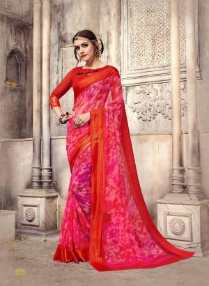 Shine Bright In This Printed Dark Pink Colored Saree Paired With Contrasting Red Colored Blouse. This Saree And Blouse Are Fabricated On Georgette Beautified With Prints All Over It. Its Fabrics Ensures Superb Comfort All Day Long. Buy Now.