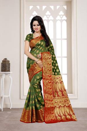 Celebrate This Festive Season Wearing This Silk Saree In Olive Green Color Paired With Olive Green Colored Blouse. This Saree And Blouse are Banarasi Silk Based Fabric Which Ensures Comfort And Gives A Rich Look Like Never Before.