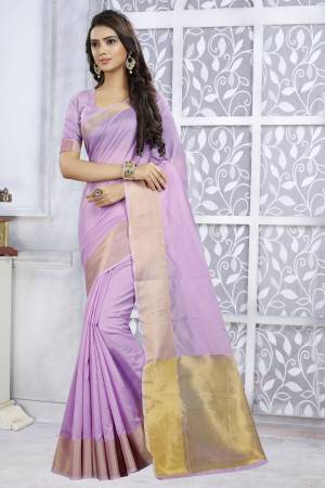 Look Pretty Wearing This Saree In Light Purple Color Paired With Light Purplre Colored Blouse. This Plain, Rich And Elegant Looking Saree Is Fabricated on Poly Cotton Which Is Durable, Easy To Drape And Carry All Day Long.