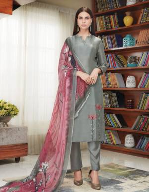 Flaunt Your Rich And Elegant Look Wearing This Designer Suit In Grey Color Paired With Contrasting Pink Colored Dupatta. Its Top Is Fabricated On Soft Silk Paired With Santoon Bottom And Chiffon Dupatta. It Is Light Weight And Easy To Carry All Day Long.