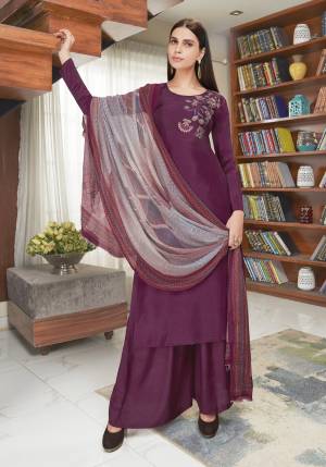 Attract All Wearing This Designer Straight Suit In Wine Color Paired With Contrasting Grey Colored Dupatta. Its Top Is Fabricated On Soft Silk Paired With Santoon Bottom And Chiffon Dupatta. Its Top Has Elegant Embroidery Over The Shoulder With Digital Printed Dupatta.  Buy This Saree Now.