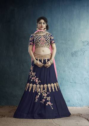 Enhance Your Personality Wearing This Designer Lehenga Choli In Navy Blue Color Paired With Contrasting Fuschia Pink Colored Dupatta. Its Blouse Are Lehenga Are Rayon Silk Based Paired With Georgette Fabricated Dupatta. Buy Now.
