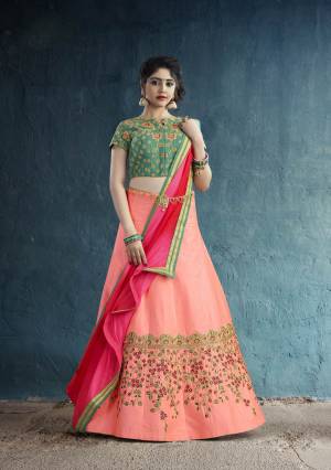 Go Colorful Wearing This Designer Lehenga Choli In Green Color Paired With Peach Colored Lehenga And Dark Pink Colored Dupatta. This Pretty Lehenga Choli Is Fabricated On Art Silk Paired With Chiffon Fabricated Dupatta. It Has Attractive Embroidery Over The Lehenga Panel And Blouse. 