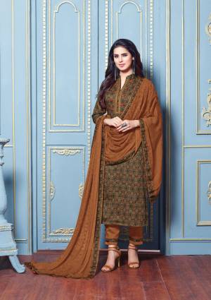 Dark Colors Are Must In Every Womes Wardrobe, Grab This Pretty Semi-Stitched Straight Suit In Dark Green Colored Top Paired With Light Brown Colored Bottom And Dupatta. Its Top And Bottom Are Cotton Satin Based Fabric Paired With Chiffon Dupatta. Buy This Suit Now.
