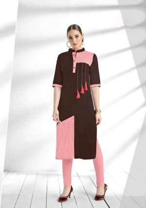 Here Is A Lovely Readymade Designer Kurti In Brown And pink Color Fabricated On Cotton Slub. This Pretty Kurti Has Pink Colored Pattern. Also It Is Light Weight And Easy To Carry All Day Long.