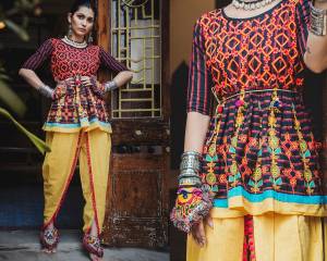 Go Colorful With This Designer Pair Of Kedias For Women In Multi Colored Top Paired With Yellow Colored Dhoti. This Top and Bottom Are Khadi Based Fabric Beautified With Thread Work And Lace Border. 
