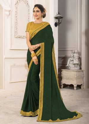 Enhance Your Personality Wearing This Designer Saree In Dark Green Color Paired With Contrasting Musturd Yellow Colored Blouse. This Saree Is Fabricated On Georgette Chiffon Paired With Art Silk Fabricated Blouse. This Saree Will Give An Attractive Look To Your Personality, Buy Now.