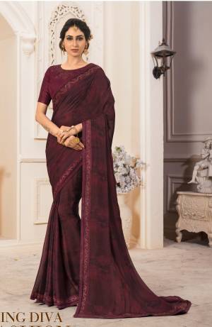 For A Royal Look, Grab This Designer Saree In Dark Maroon Color Paired With Dark Maroon Colored Blouse. This Saree Is Fabricated On Georgette Chiffon Paired With Art Silk Fabricated Blouse. Its Rich Dark Color Will Earn You Lots Of Compliments From Onlookers.