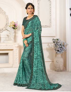 New And Unique Shade Is Here In Blue With This Saree In Teal Blue Color Paired With Teal Blue Colored Blouse. This Saree Is Fabricated On Georgette Chiffon Paired With Art Silk Fabricated Blouse. It Is Light Weight And Easy To Carry All Day Long.