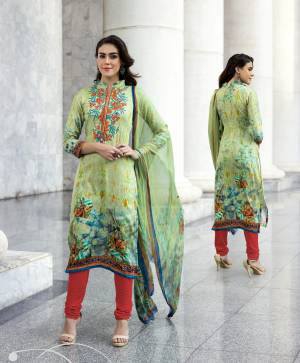 Add This Lovely Semi-Stitched Straight Suit To Your Wardrobe In Light Green Colored Top And Dupatta Paired With Contrasting Red Colored Bottom. Its Top Is Fabricated On Cotton Satin Paired With Santoon Bottom And Chiffon Dupatta. Buy This Suit Now.