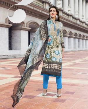Flaunt Your Rich And Elegant Taste Wearing This Grey Colored Top And Dupatta Paired With Contrasting Blue Colored Bottom. Its Top Is Fabricated On Cotton Satin Paired With Santoon Bottom And Chiffon Dupatta. It Is Beautified With Floral Prints Over The Top. Buy Now.