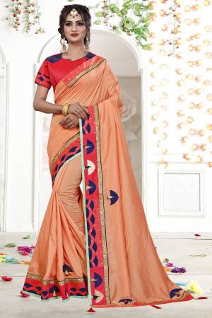 Here Is A Very Pretty Attractive Saree In Light Orange Color Paired With Contrasting Red Colored Blouse. This Saree Is Fabricated On Fancy Georgette Paired With Art Silk Fabricated Blouse. It Is Light Weight And Easy To Carry All Day Long.