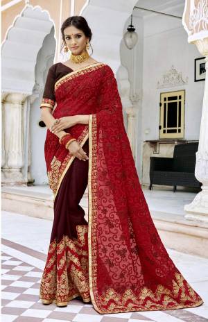 Adorn The Royal Queen Look, Wearing this Designer Saree In Red And Maroon Color Paired With Maroon Colored Blouse. This Saree Is Georgette Based Fabric Paired With Art Silk Fabricated Blouse. It Is Beeautified With Heavy Embroidery All Over Pallu And Over The Saree Panel.