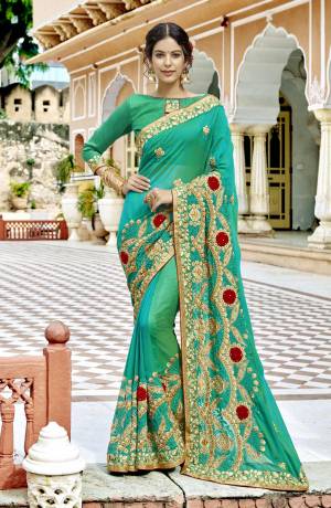 Get Ready For The Upcoming Wedding And Festive Season With This Designer Saree In Green Color Paired With Green Colored Blouse, This Silk Based Saree Is Beautified With Heavy Contrasting Embroidery Which Gives A Rich Look To Your Personality. Buy Now.