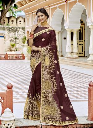 Look Like A Beauty Queen Wearing This Designer Saree In Maroon Color Paired With Maroon Colored blouse. This Saree IS Georgette Based Paired With Art Silk Fabricated Blouse. Buy This Saree Now.