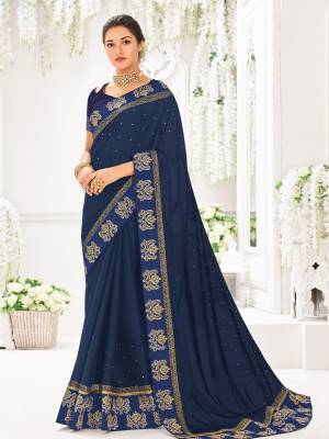 Drape this Navy Blue color bright georgette saree. this gorgeous saree featuring a beautiful mix of designs. look gorgeous at an upcoming any occasion wearing the saree. Its attractive color and designer heavy embroidered design, Flower patch design, moti design, beautiful floral design work over the attire & contrast hemline adds to the look. Comes along with a contrast unstitched blouse.