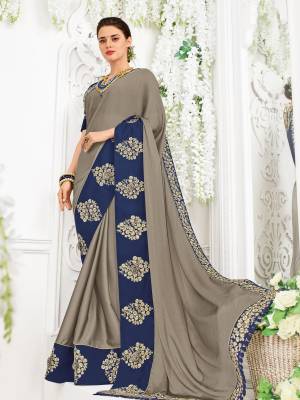 Show your elegance by wearing this gorgeous grey color bright georgette saree. Ideal for party, festive & social gatherings. this gorgeous saree featuring a beautiful mix of designs. Its attractive color and designer heavy embroidered design, Flower patch design, moti design, beautiful floral design work over the attire & contrast hemline adds to the look. Comes along with a contrast unstitched blouse.