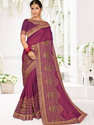 Get this amazing saree and look pretty like never before. wearing this Wine color two tone silk saree. Ideal for party, festive & social gatherings. this gorgeous saree featuring a beautiful mix of designs. Its attractive color and designer heavy embroidered design, Flower patch design, moti design, beautiful floral design work over the attire & contrast hemline adds to the look. Comes along with a contrast unstitched blouse.