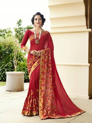 Adorn The Pretty Angelic Look Wearing This Designer Saree In Red Color Paired With Red Colored Blouse. This Saree Is Fabricated On Georgette Paired With Art Silk Fabricated Blouse. It Is Light Weight And Perfect For Festive Wear. Buy Now.