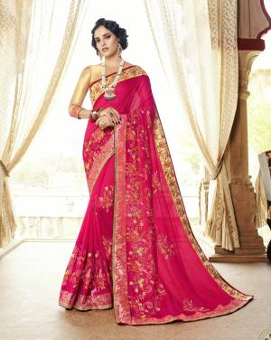 Look Pretty Attractive Wearing This Designer Saree In Dark Pink Color Paired With Beige Colored Blouse. This Saree Is Fabricated On Art Silk Paired With Art Silk Fabricated Blouse. It Is Beautified With Heavy Embroidery All Over.