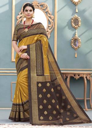 Celebrate this Festive Season Wearing This Silk Based Saree In Musturd Yellow Color Paired With Brown Colored Blouse. This Saree And Blouse Are Fabricated On Art Silk Beautified With Prints. 